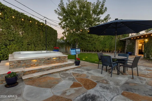 a swimming pool with outdoor seating