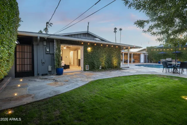 a view of a swimming pool with an outdoor space and seating area