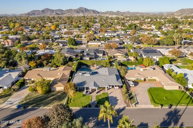 an aerial view of residential houses with outdoor space