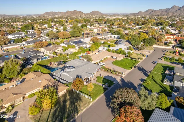 an aerial view of residential houses with outdoor space