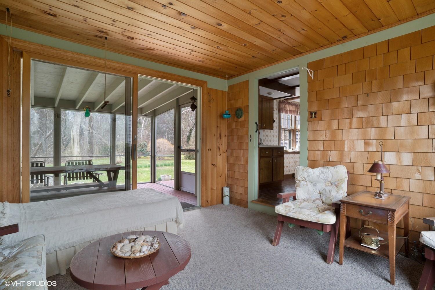 20 Smith Farm Road Eastham, MA 02642 - Photo 8 of 15 a living room with furniture and a large window