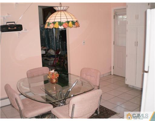 10 Eagle Road Edison, NJ 08820 - Photo 6 of 12 a dining room with furniture and wooden floor