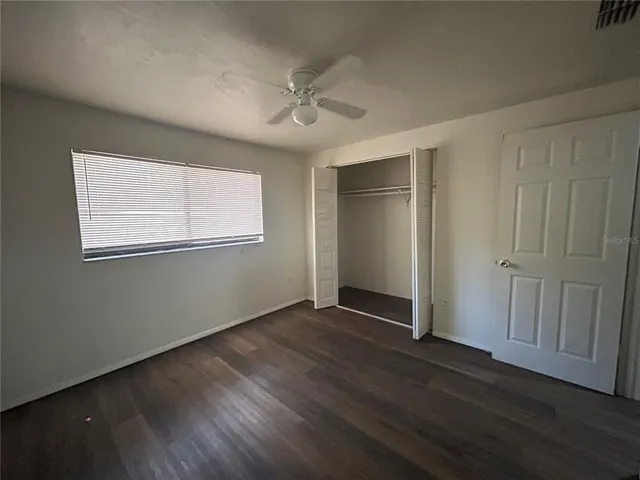 a bathroom with a sink mirror and toilet