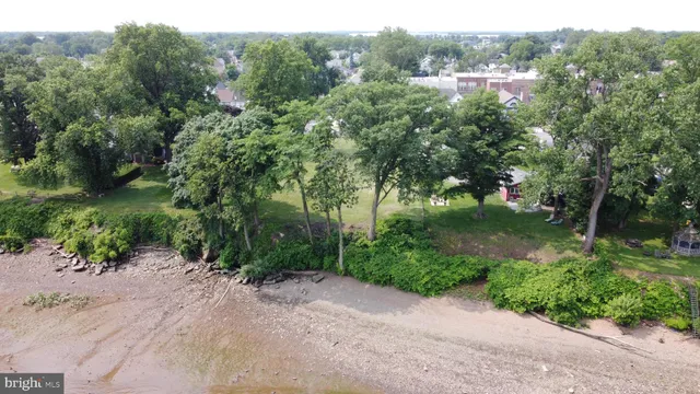 a view of a street with a park
