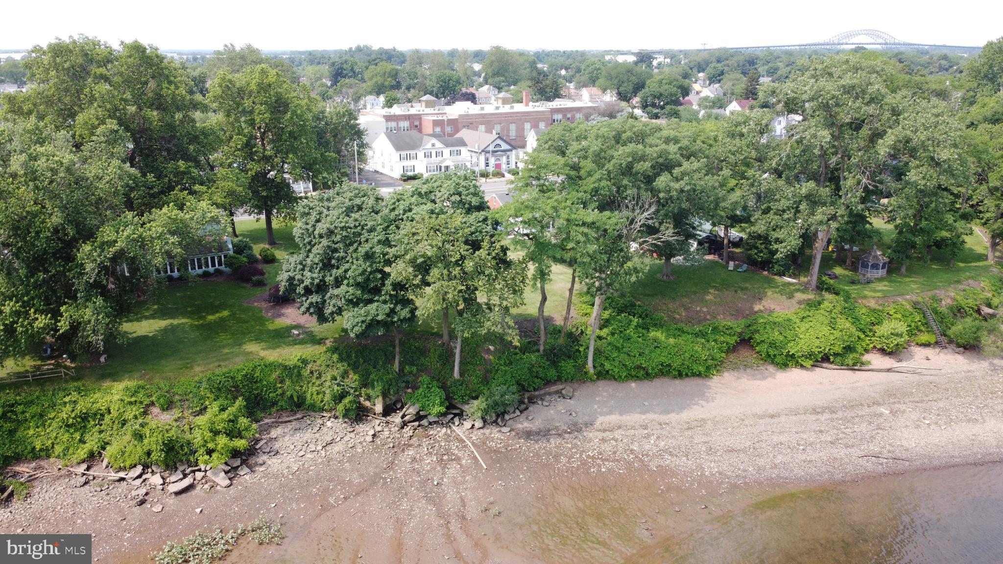 201 West Front Street Florence, NJ 08518 - Photo 12 of 17 a view of a street with a yard and large trees