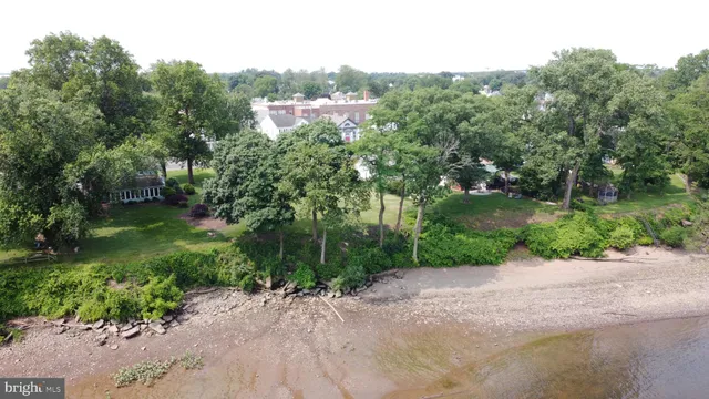 an aerial view of a houses with lake view