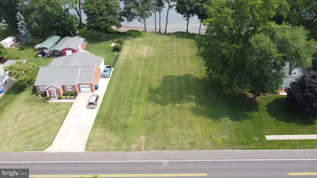 an aerial view of a residential houses with outdoor space
