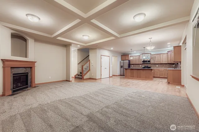 a view of a livingroom with furniture and a fireplace