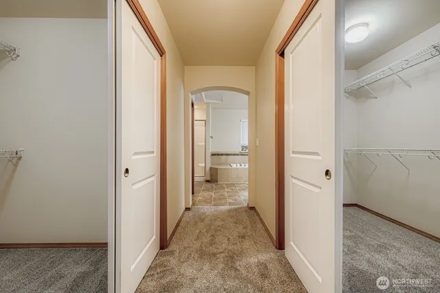 a view of a bathroom from a corridor