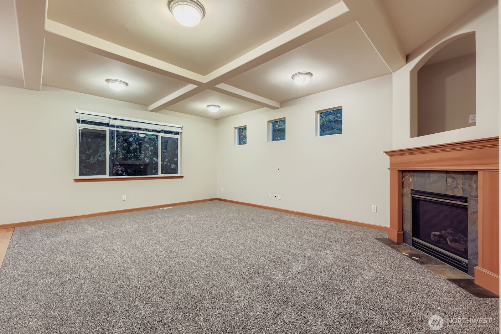 16305 37th Drive Southeast Bothell, WA 98012 - Photo 10 of 34 a view of an empty room with a fireplace and a window