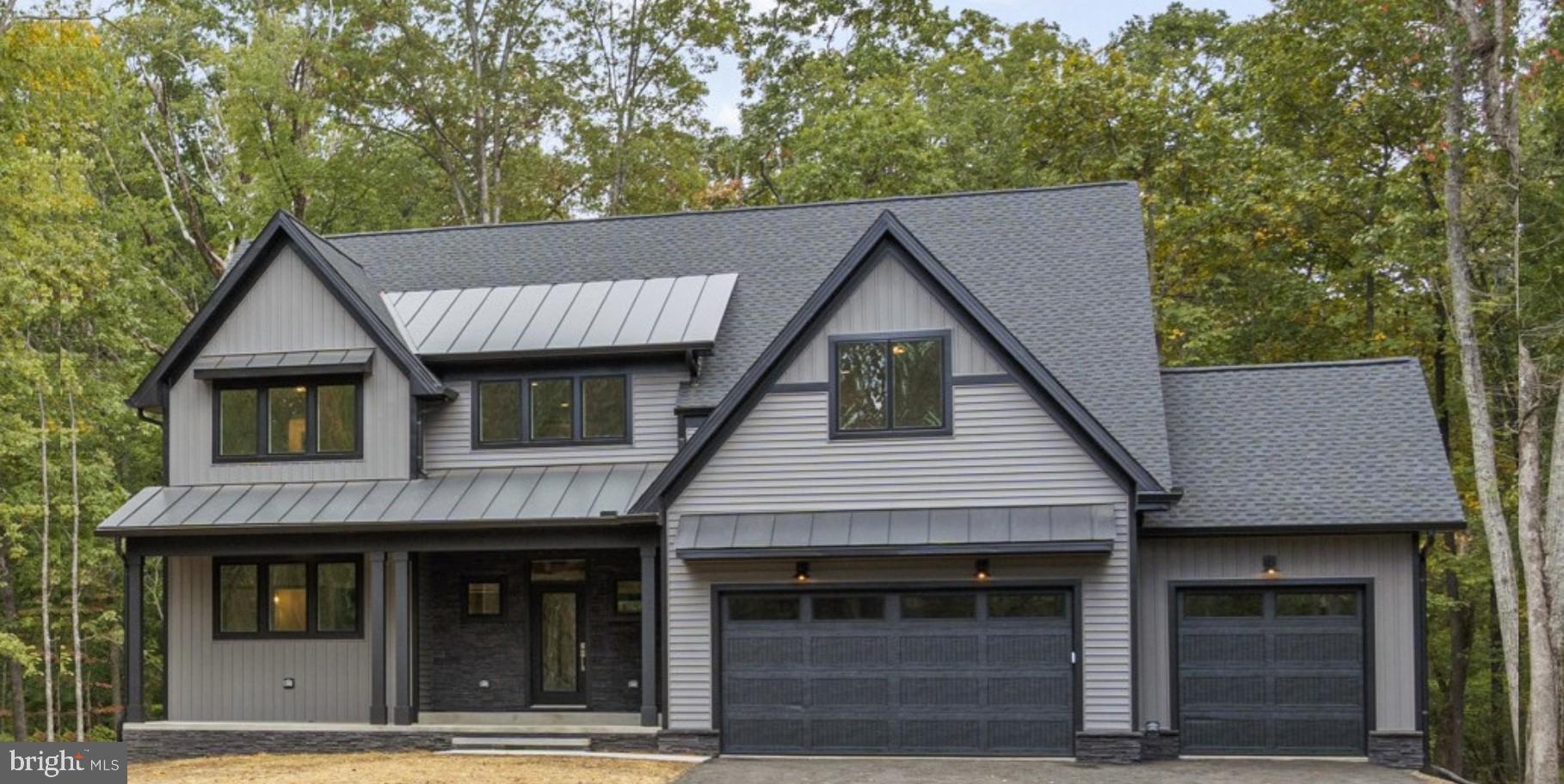 a front view of a house with a garage