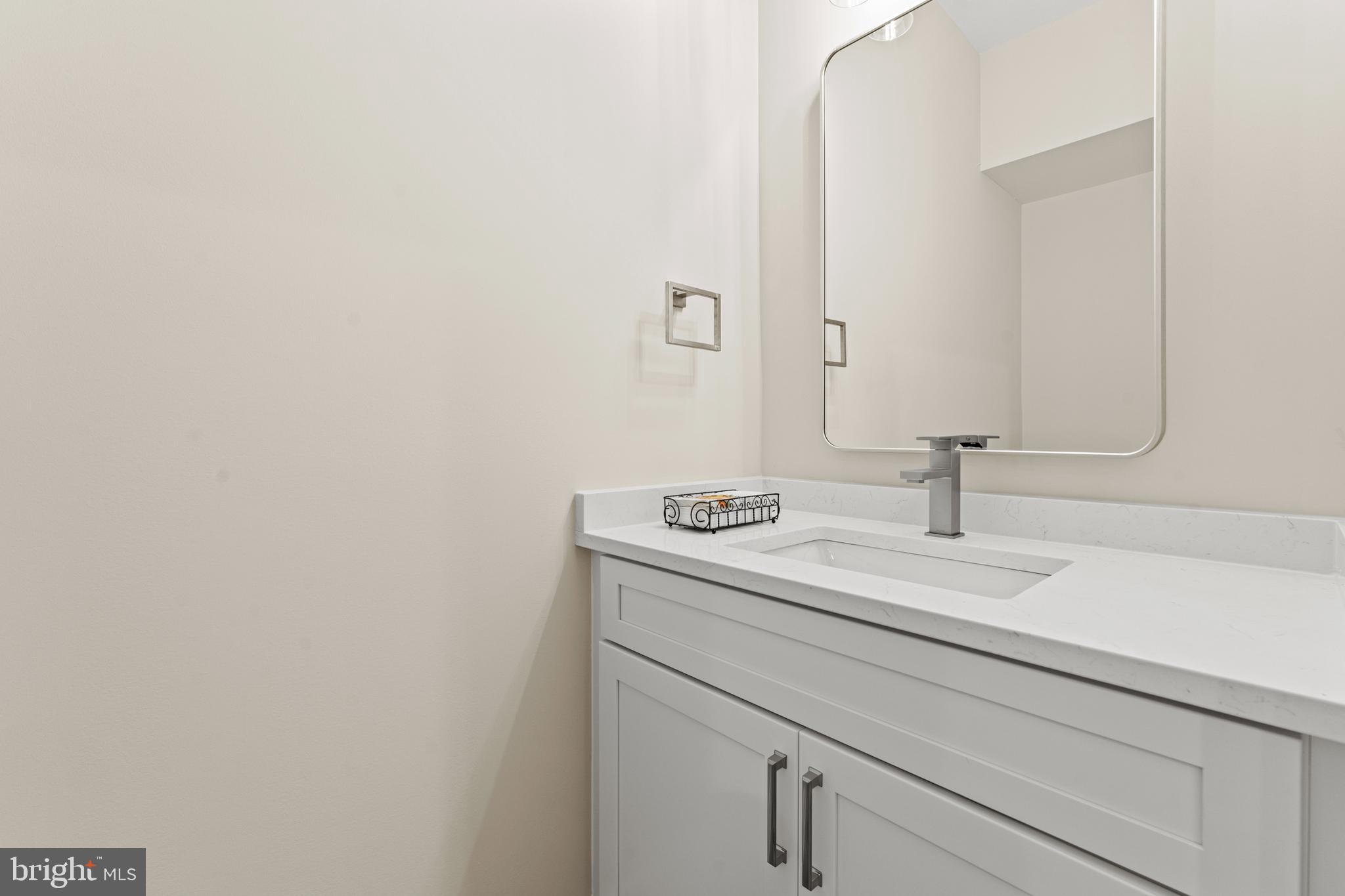 5725 Turner Road Broad Run, VA 20137 - Photo 13 of 57 a bathroom with a sink and a mirror