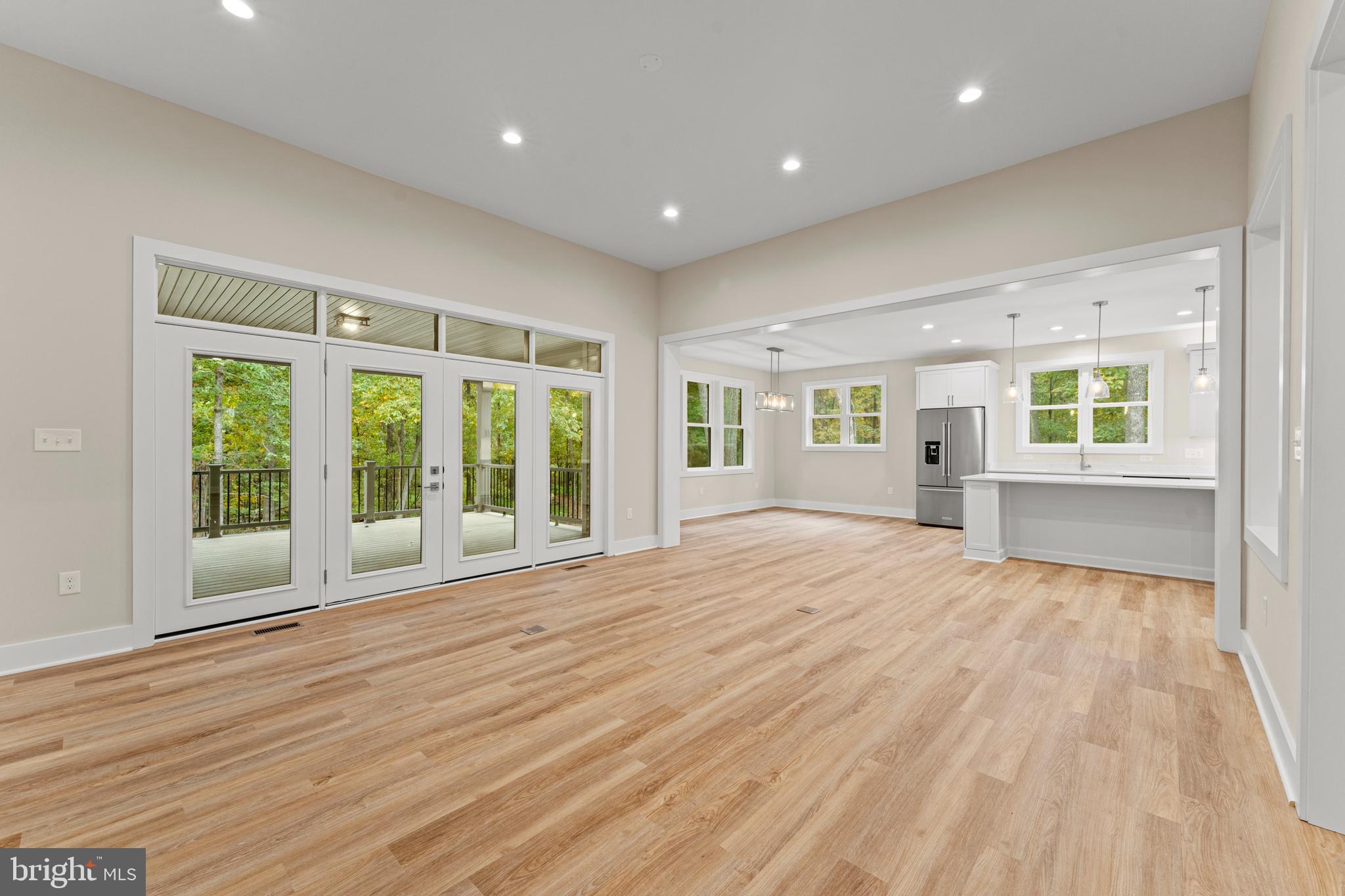 5725 Turner Road Broad Run, VA 20137 - Photo 15 of 57 a view of an empty room with wooden floor and a window