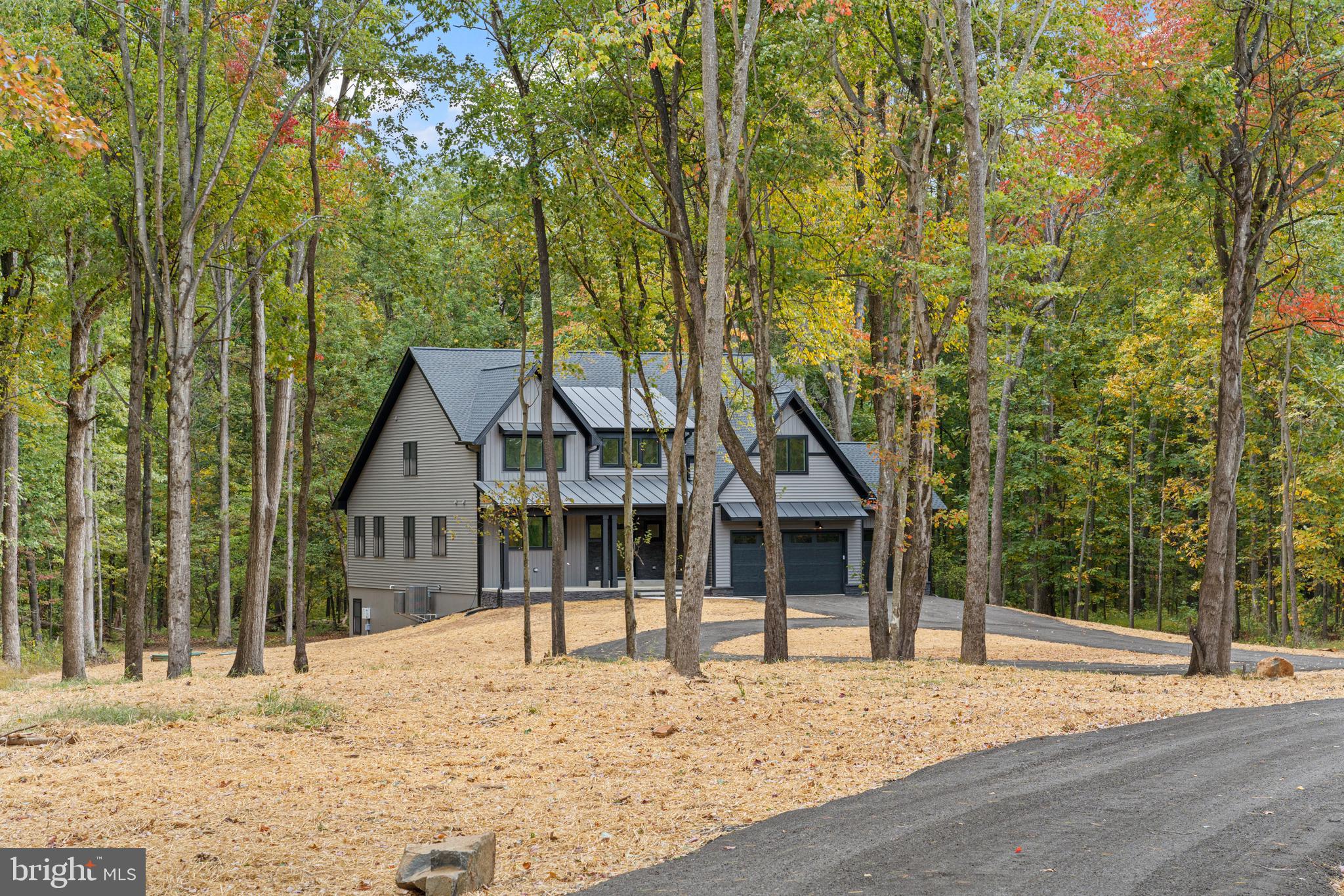 5725 Turner Road Broad Run, VA 20137 - Photo 2 of 57 a view of a house with trees in the background