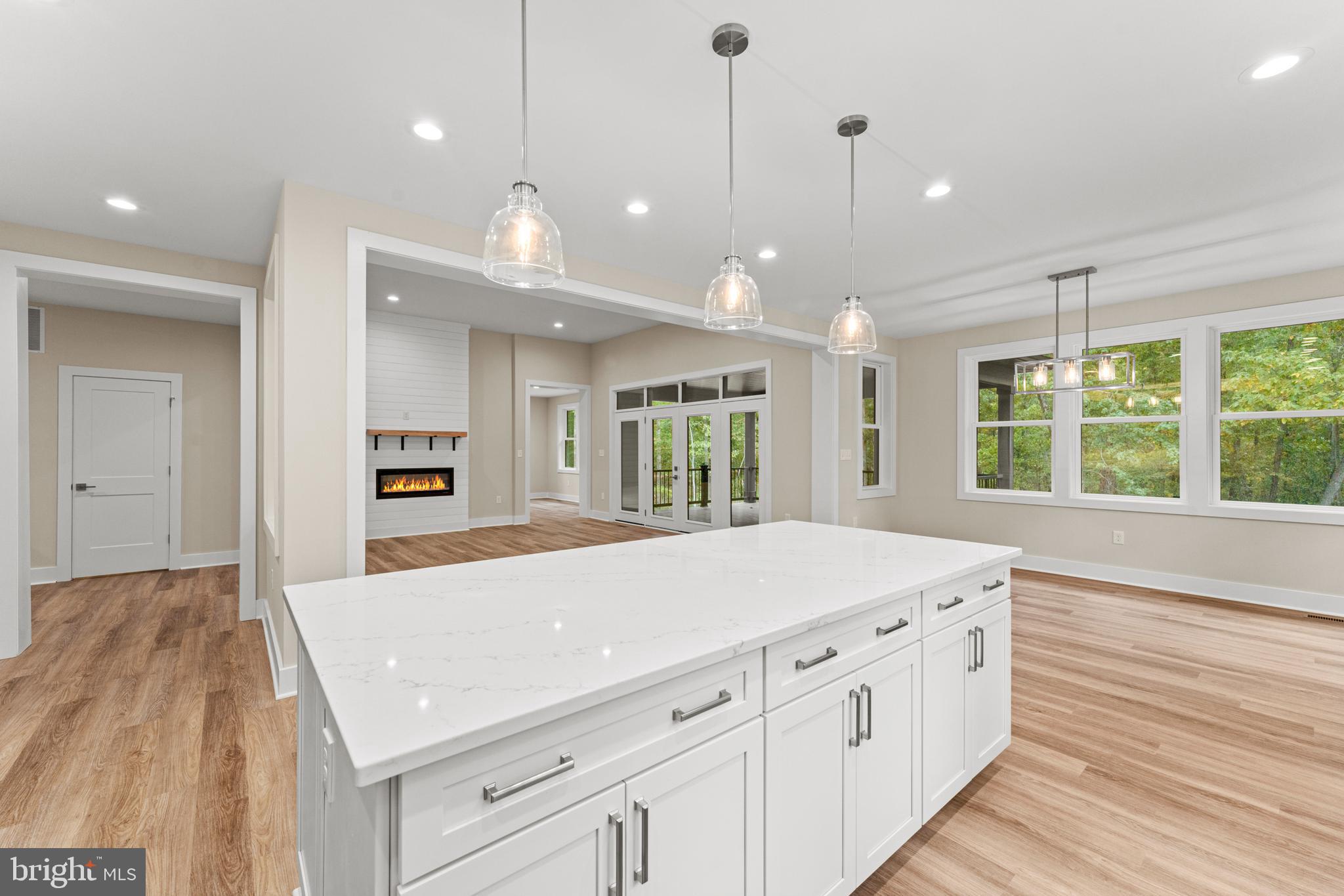 5725 Turner Road Broad Run, VA 20137 - Photo 20 of 57 a kitchen with kitchen island a counter space a sink appliances and a large window