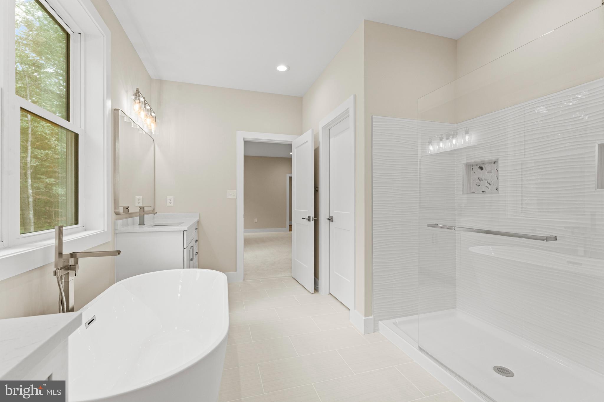 5725 Turner Road Broad Run, VA 20137 - Photo 28 of 57 a bathroom with a tub sink and mirror