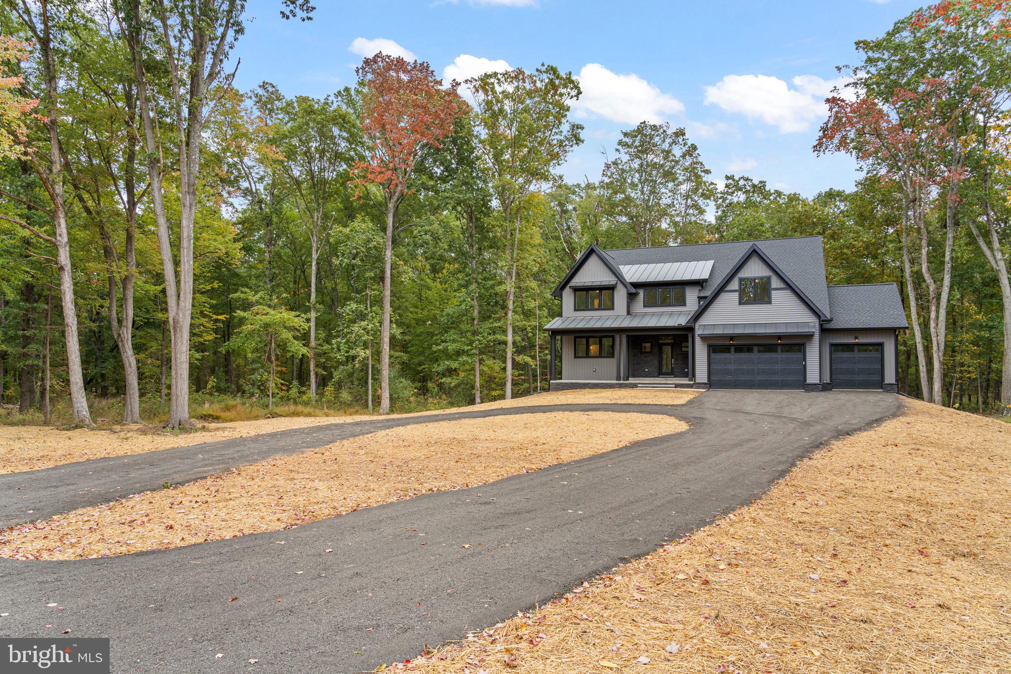 5725 Turner Road Broad Run, VA 20137 - Photo 3 of 57 a front view of a house with a yard and trees