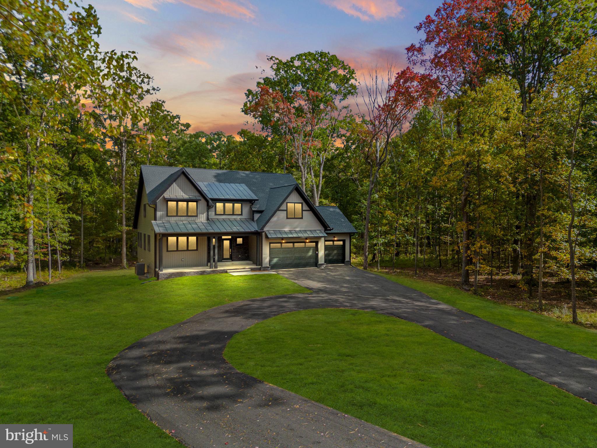 5725 Turner Road Broad Run, VA 20137 - Photo 54 of 57 a front view of a house with a yard and trees