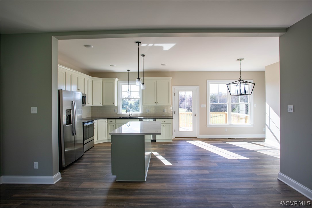460 Jamestown Road Farmville, VA 23901 - Photo 15 of 50 a living room with kitchen island granite countertop wooden floor and a dining table