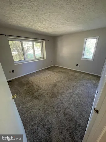 a kitchen with granite countertop lots of counter top space and stainless steel appliances
