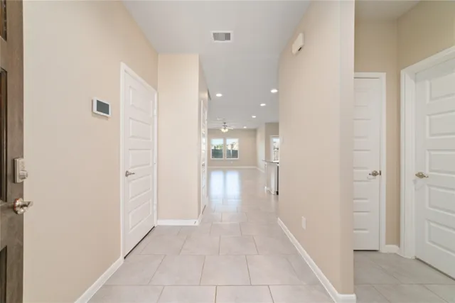 a kitchen with granite countertop a sink stove top oven and microwave