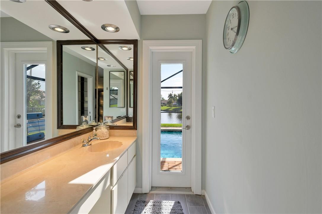 10556 Fenway Place Boca Raton, FL 33498 - Photo 16 of 30 Master bath leading to pool area