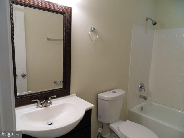43441 Postrail Square Ashburn, VA 20147 - Photo 15 of 24 a bathroom with a sink toilet and shower
