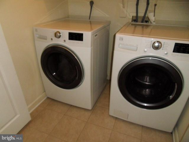 43441 Postrail Square Ashburn, VA 20147 - Photo 17 of 24 a utility room with dryer and washer