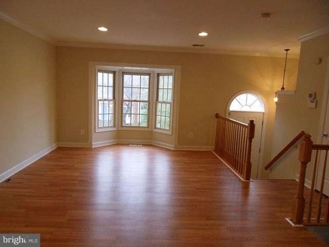 43441 Postrail Square Ashburn, VA 20147 - Photo 6 of 24 wooden floor in an empty room with a window