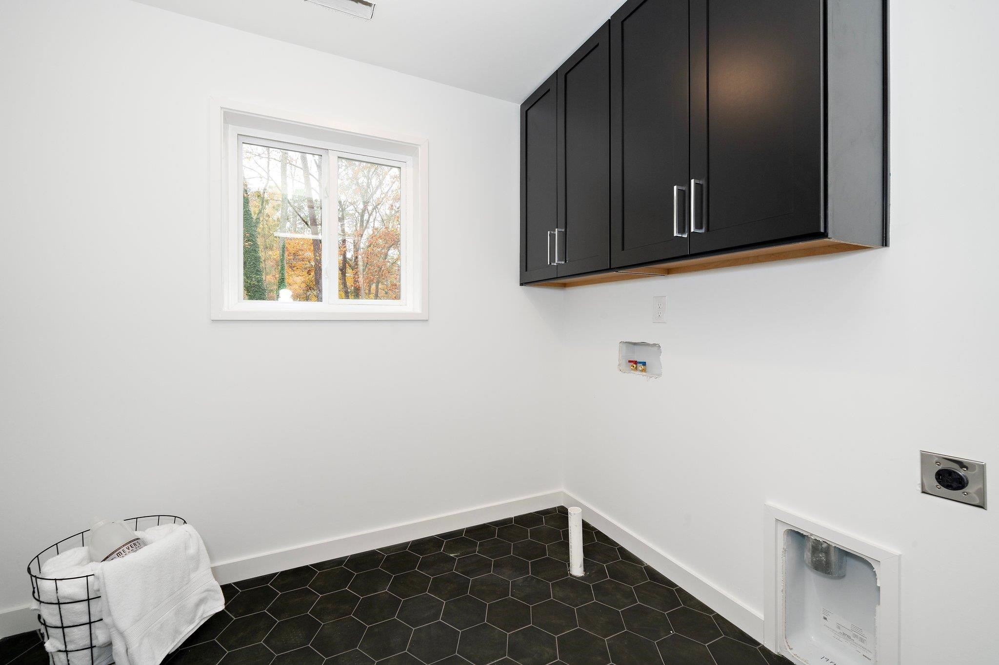 2300 Kilburn Road Raleigh, NC 27604 - Photo 15 of 42 a view of storage and utility room with wooden floor