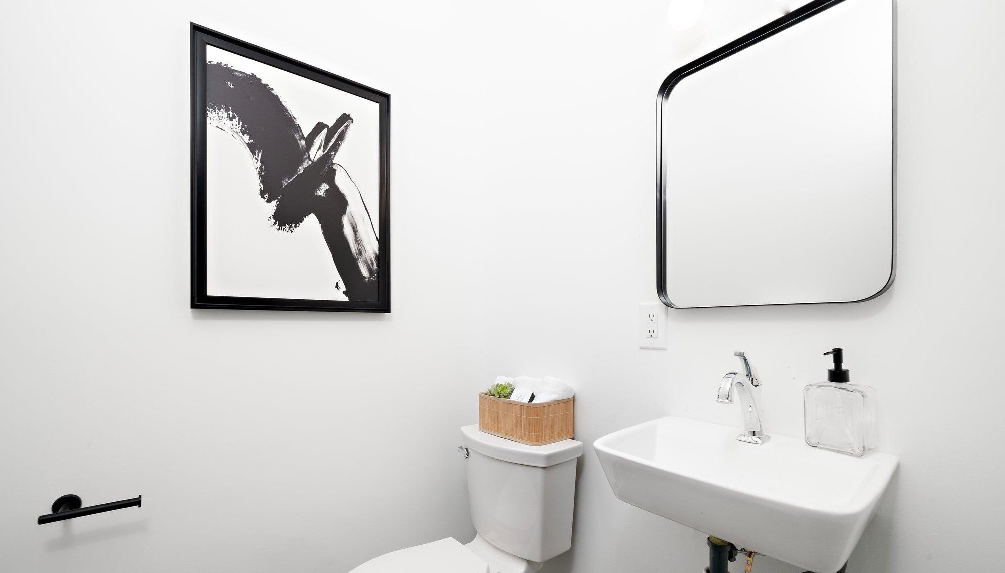 2300 Kilburn Road Raleigh, NC 27604 - Photo 23 of 42 a bathroom with a toilet sink and mirror