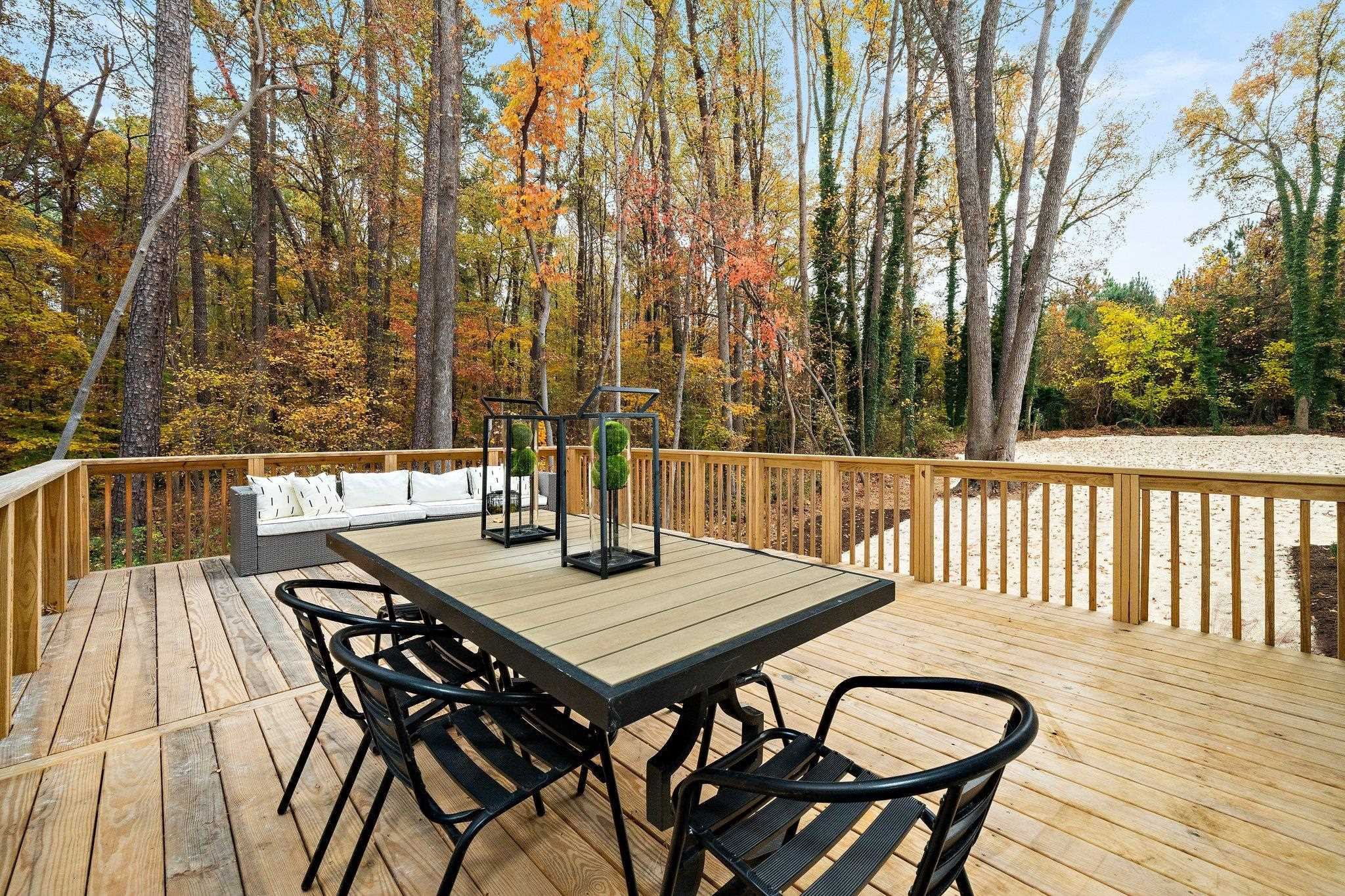 2300 Kilburn Road Raleigh, NC 27604 - Photo 31 of 42 a view of a wooden chairs and table on the deck