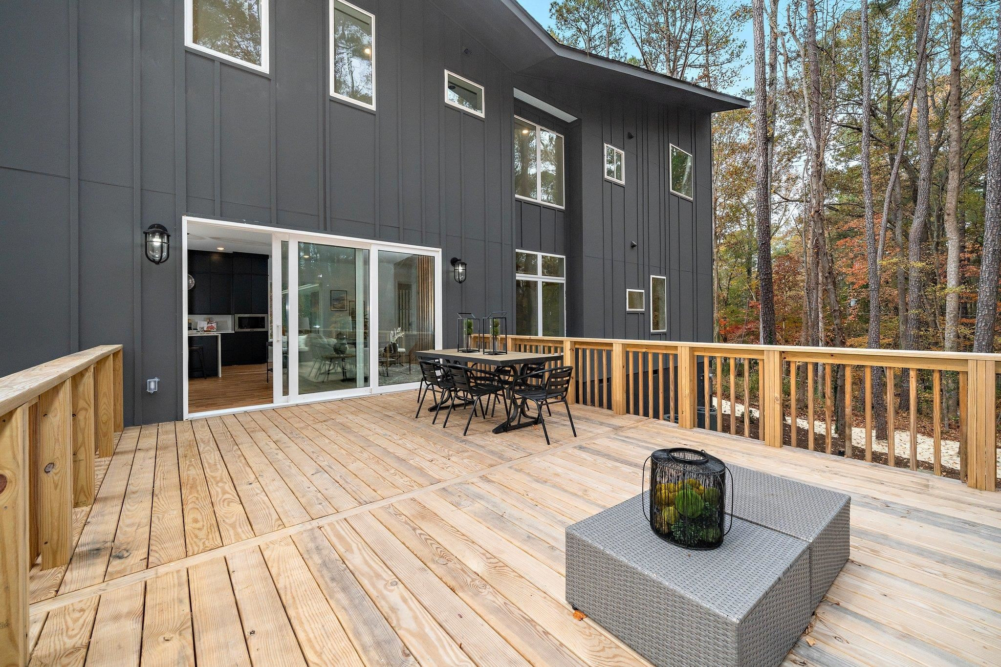 2300 Kilburn Road Raleigh, NC 27604 - Photo 32 of 42 a view of a deck with table and chairs and wooden floor