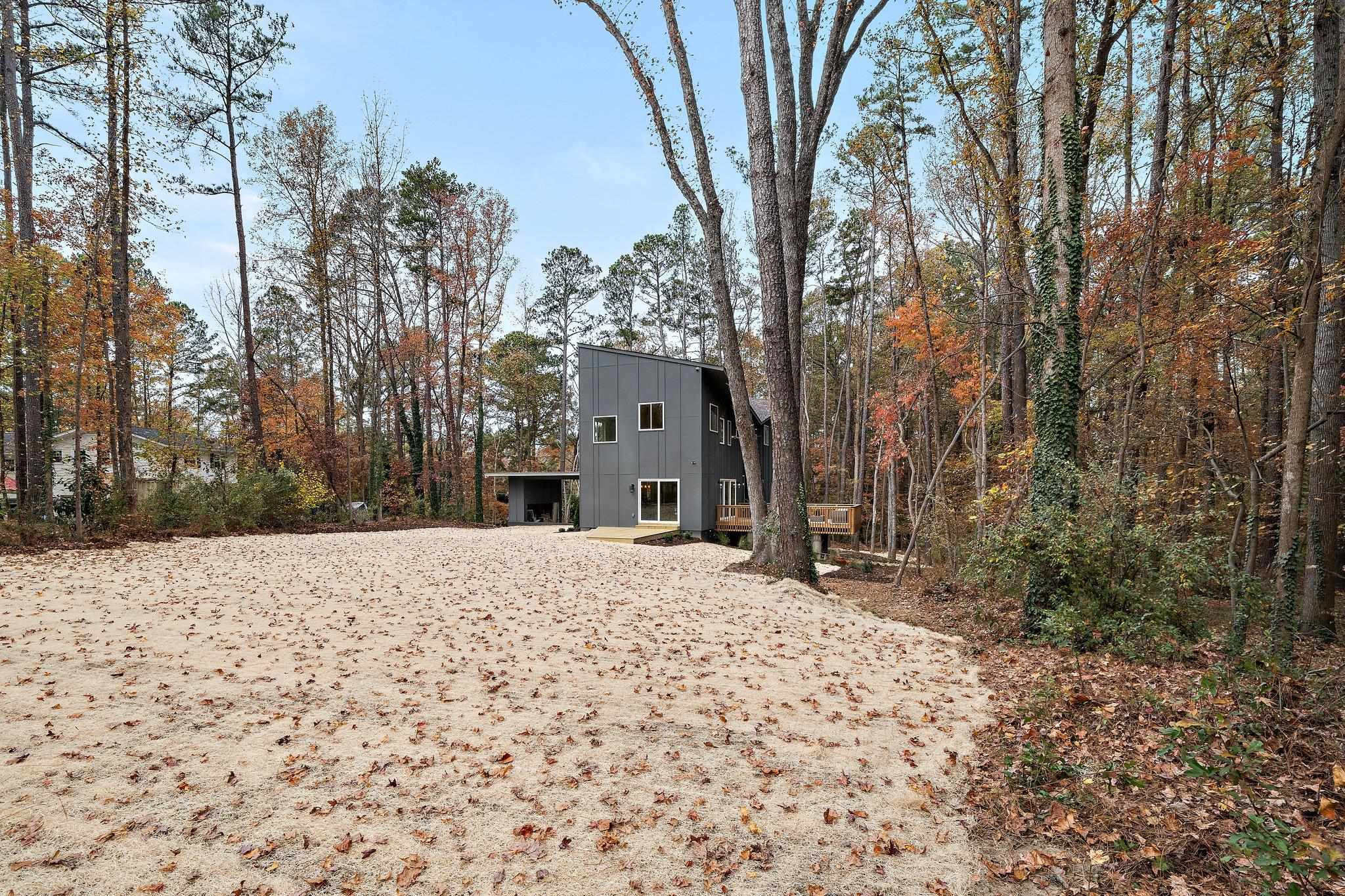 2300 Kilburn Road Raleigh, NC 27604 - Photo 35 of 42 a front view of a house with a yard covered in snow