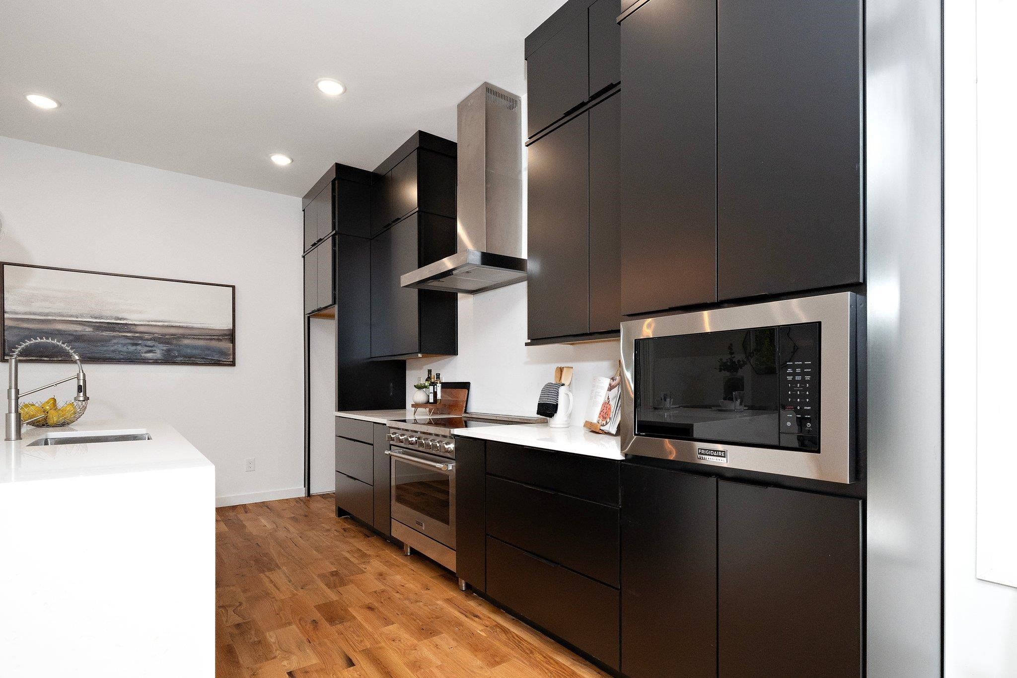 2300 Kilburn Road Raleigh, NC 27604 - Photo 6 of 42 a kitchen with stainless steel appliances a sink stove and refrigerator