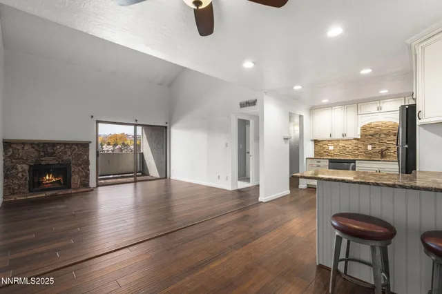 an open kitchen with a table and chairs in it