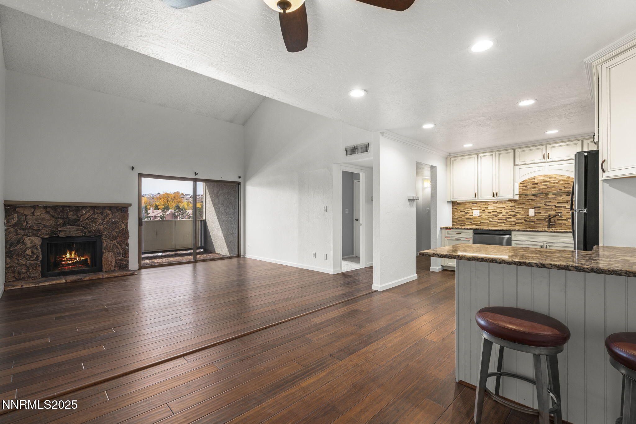 2845 Idlewild Drive, Unit 313 Reno, NV 89509 - Photo 17 of 27 an open kitchen with a table and chairs in it