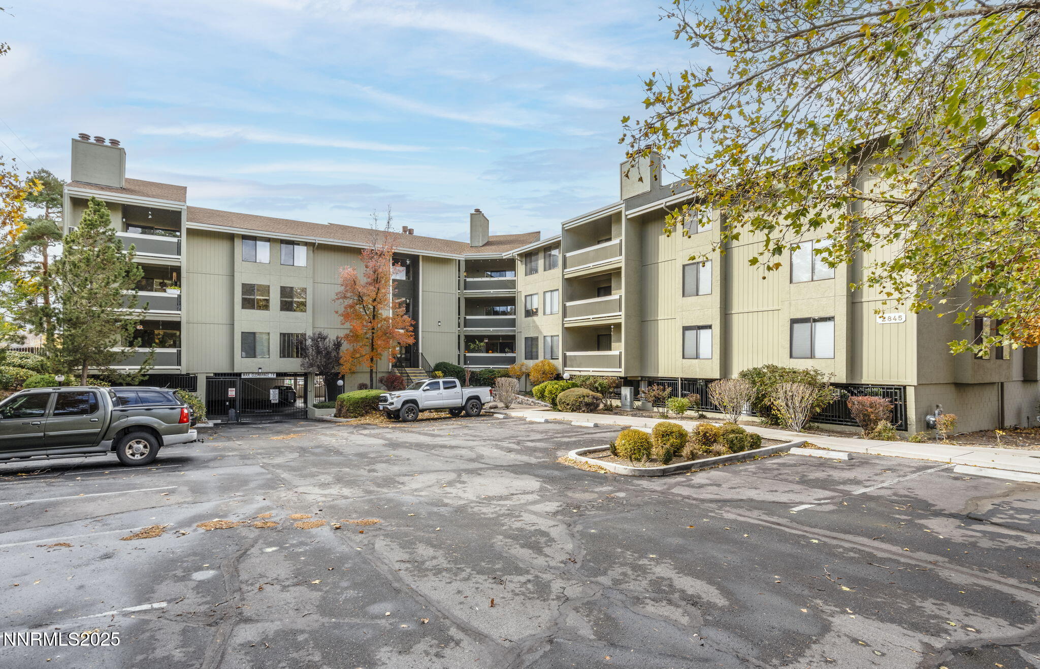 2845 Idlewild Drive, Unit 313 Reno, NV 89509 - Photo 2 of 27 a view of a patio with table and chairs and a barbeque