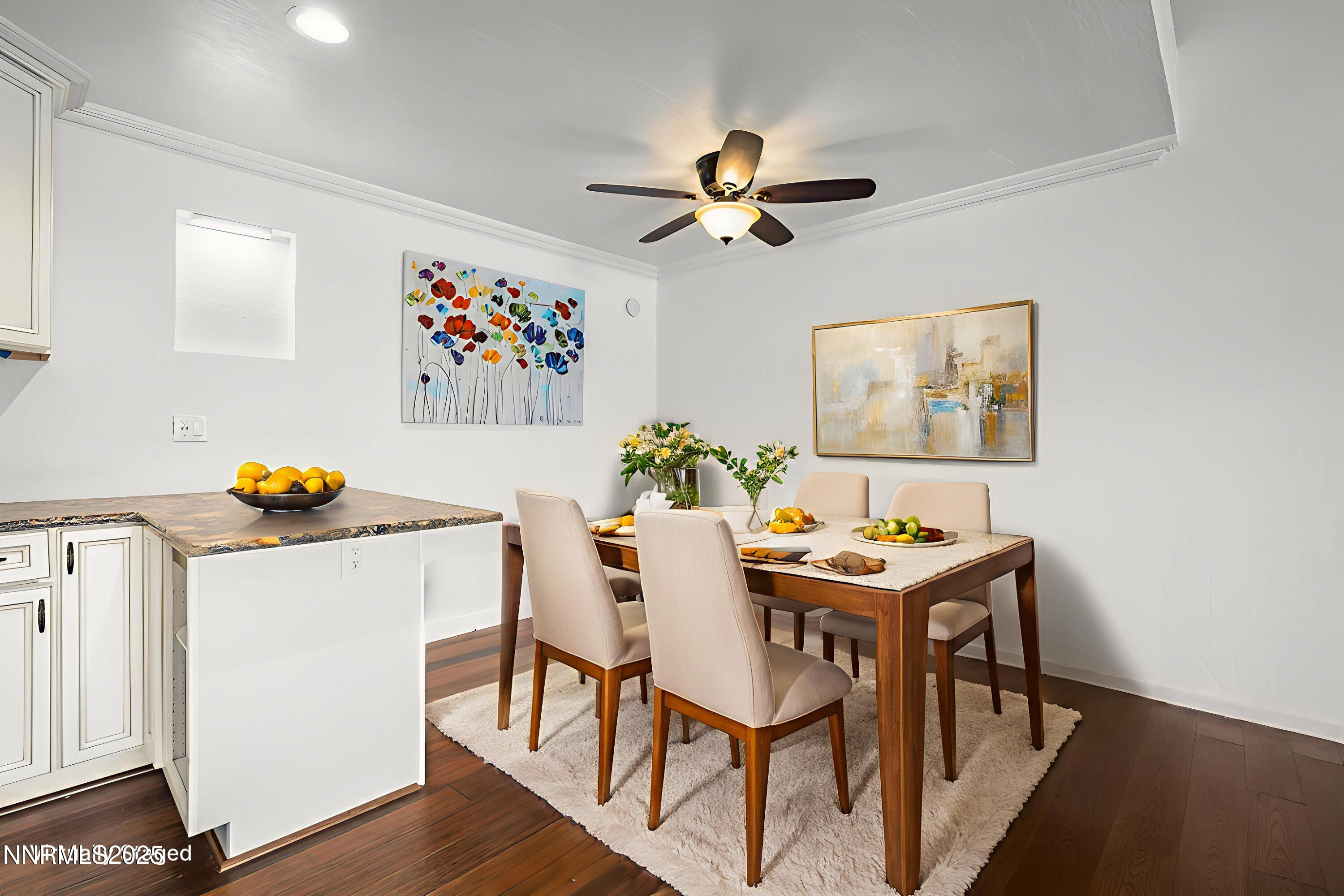 2845 Idlewild Drive, Unit 313 Reno, NV 89509 - Photo 3 of 27 a view of a dining room with furniture and wooden floor