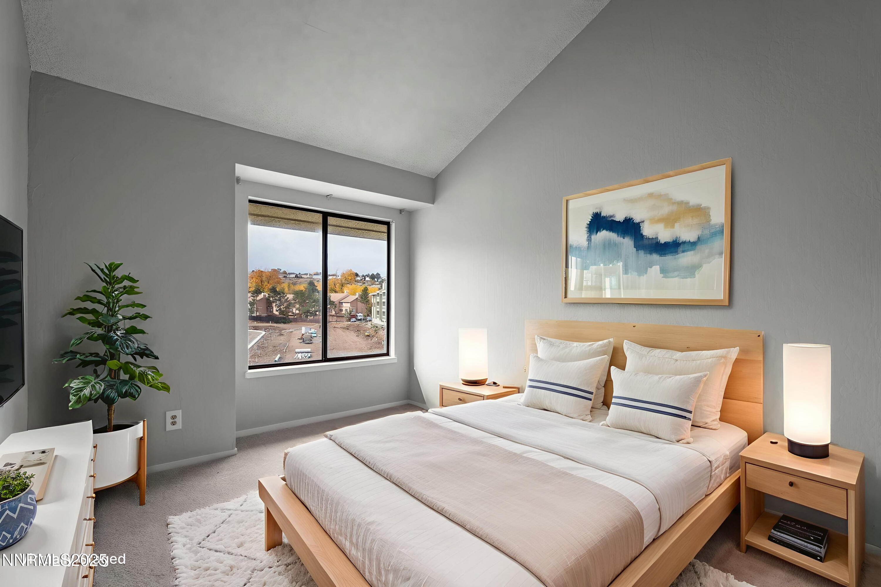 2845 Idlewild Drive, Unit 313 Reno, NV 89509 - Photo 4 of 27 a bedroom with a large bed and a window