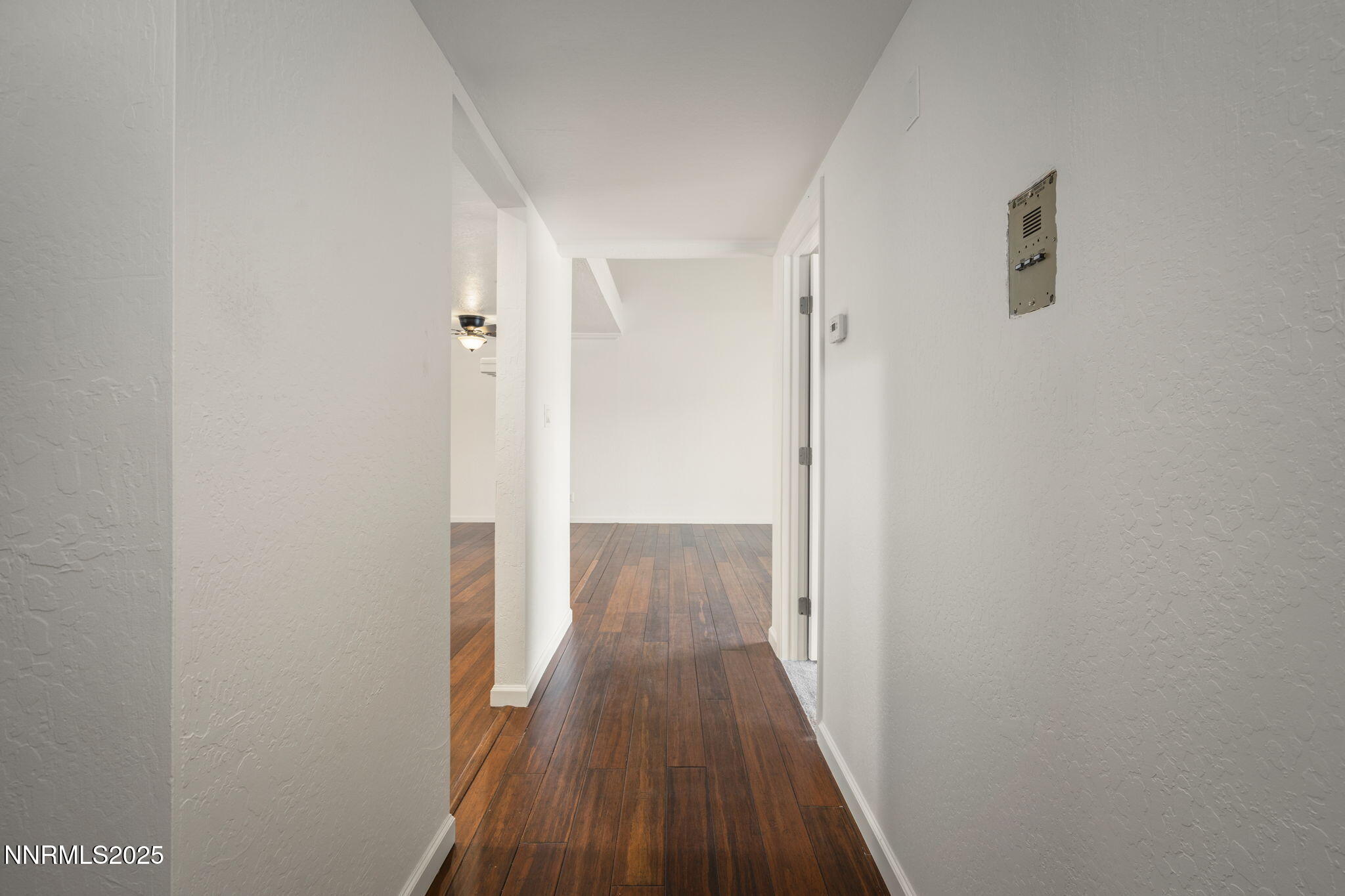 2845 Idlewild Drive, Unit 313 Reno, NV 89509 - Photo 5 of 27 a view of a hallway with wooden floor