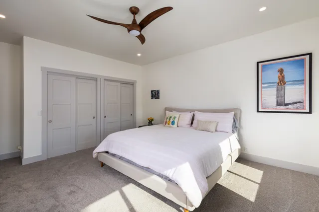 a view of a patio with couches table and chairs and potted plants