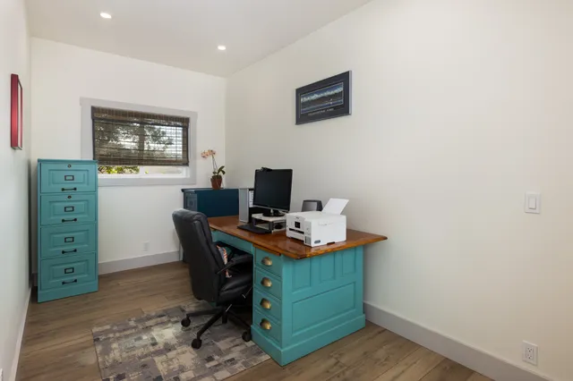 a view of storage and utility room with stairs and toys