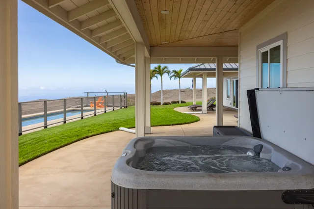 a large kitchen with counter top space a sink stainless steel appliances and cabinets
