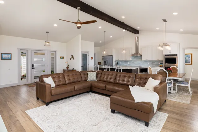 a kitchen with stainless steel appliances a sink stove and refrigerator