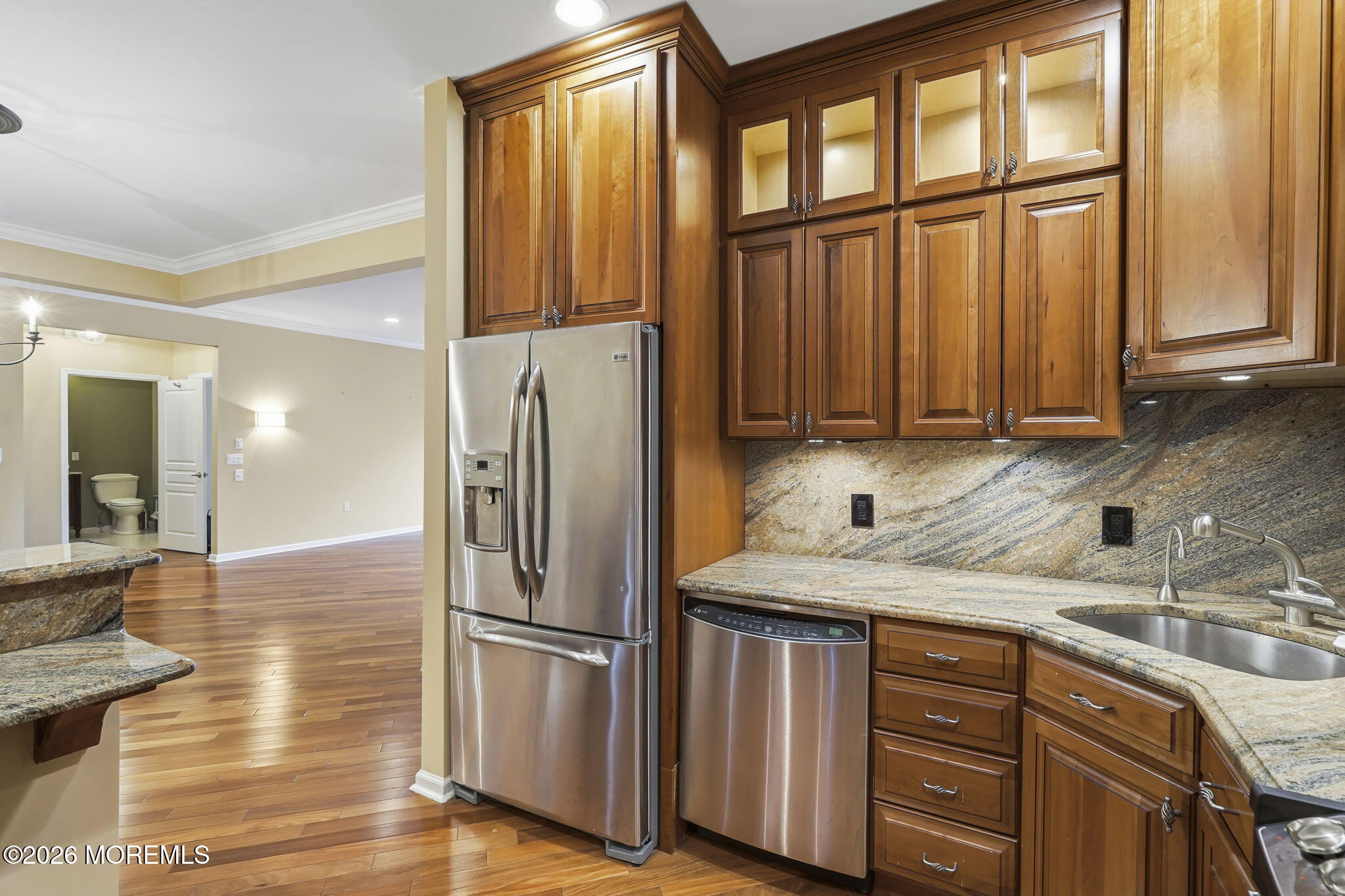 106 Potts Road Morganville, NJ 07751 - Photo 10 of 25 a kitchen with stainless steel appliances granite countertop a refrigerator and a sink