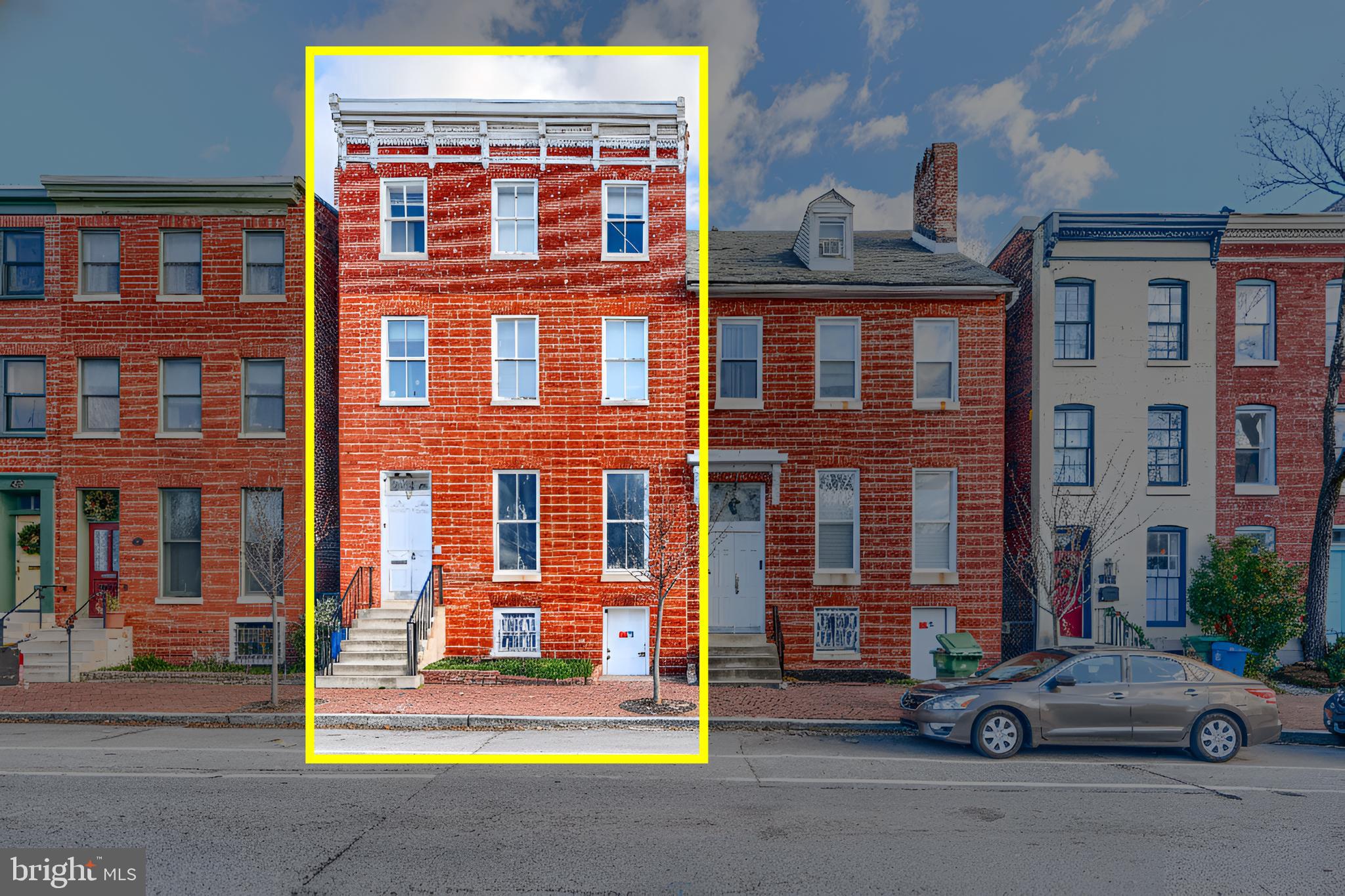 617 North Paca Street Baltimore, MD 21201 - Photo 1 of 20 a car parked in front of a building