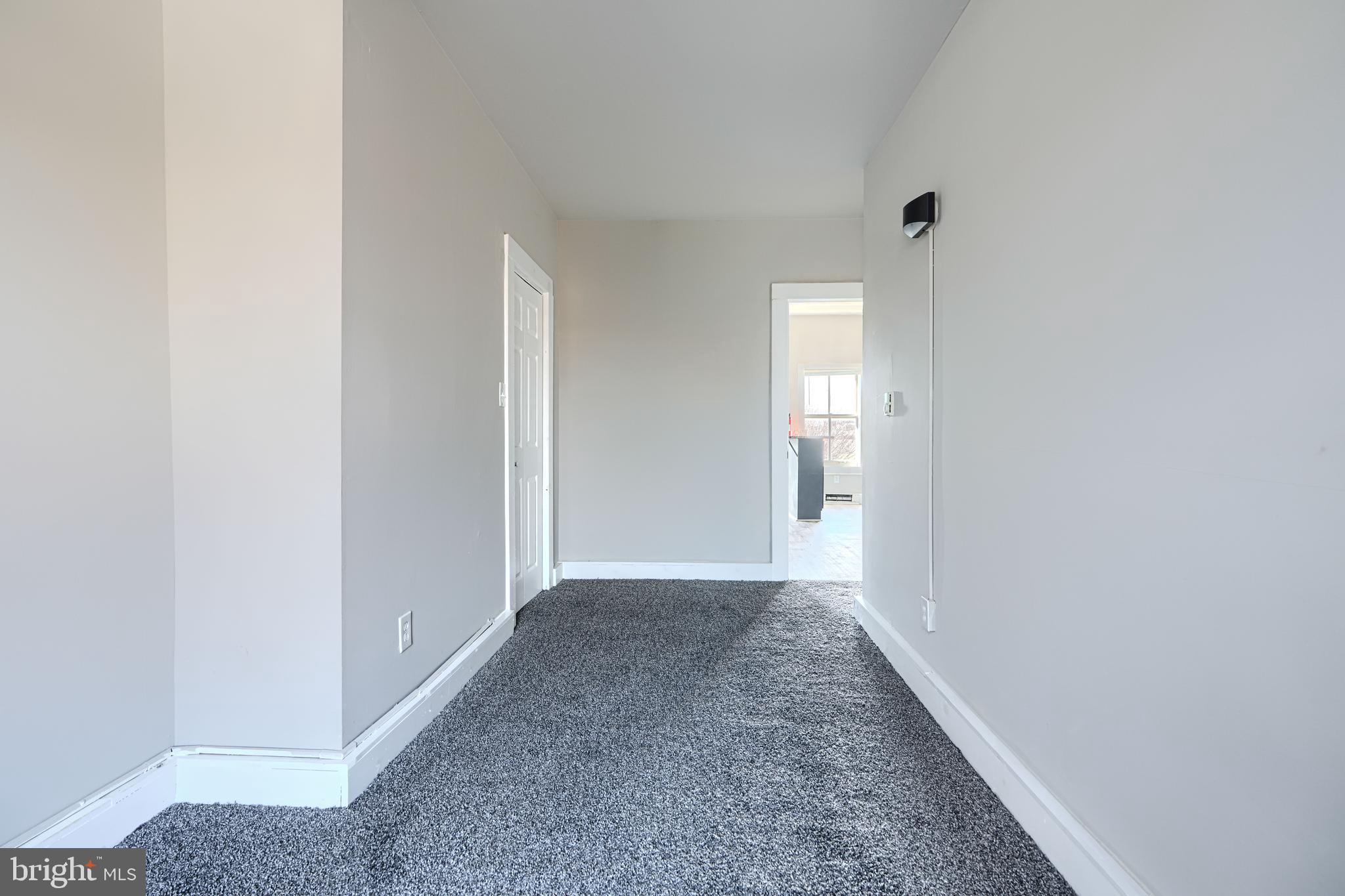 617 North Paca Street Baltimore, MD 21201 - Photo 17 of 20 a view of an empty room with window