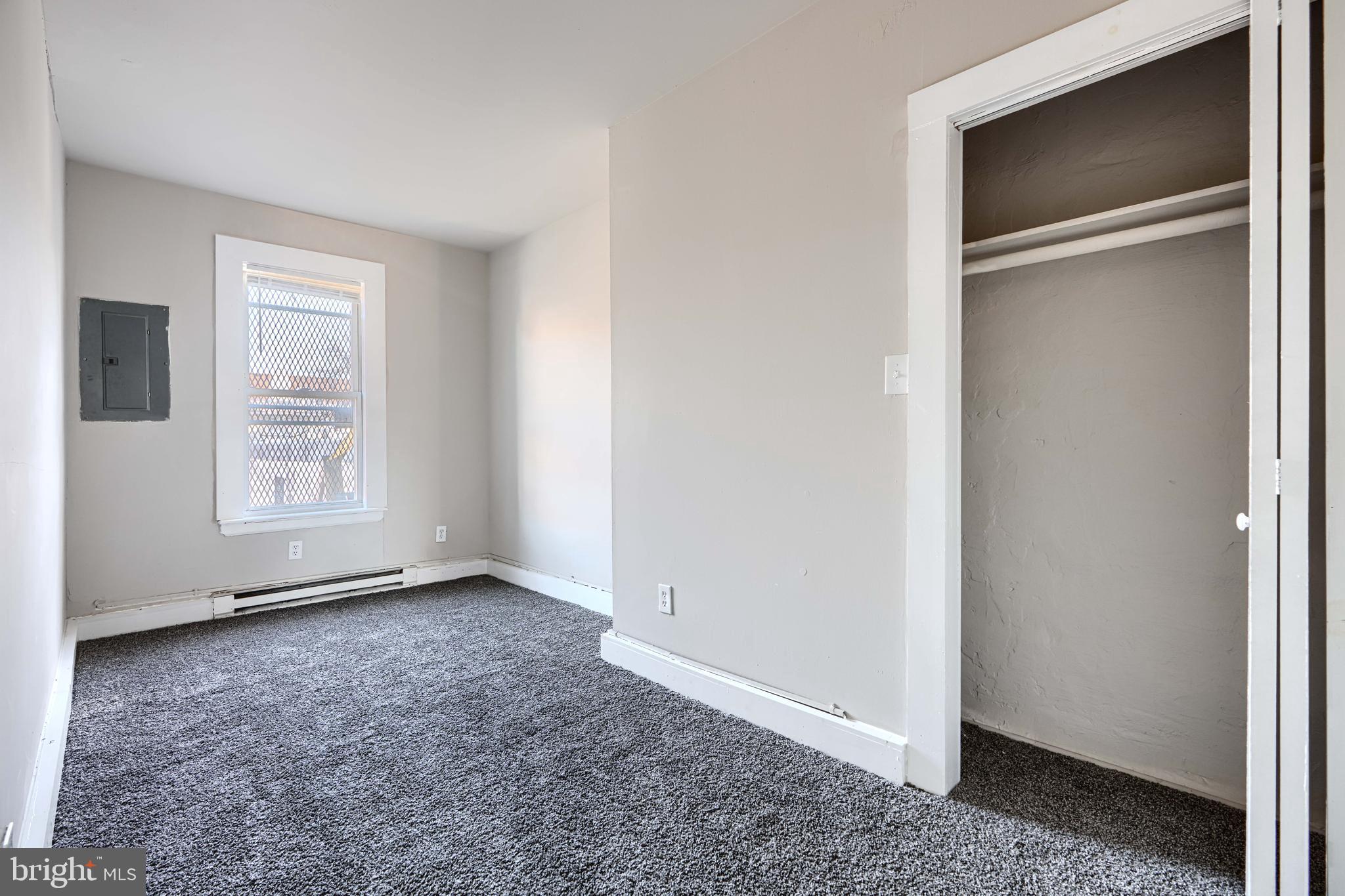 617 North Paca Street Baltimore, MD 21201 - Photo 18 of 20 a view of an empty room with closet and a window