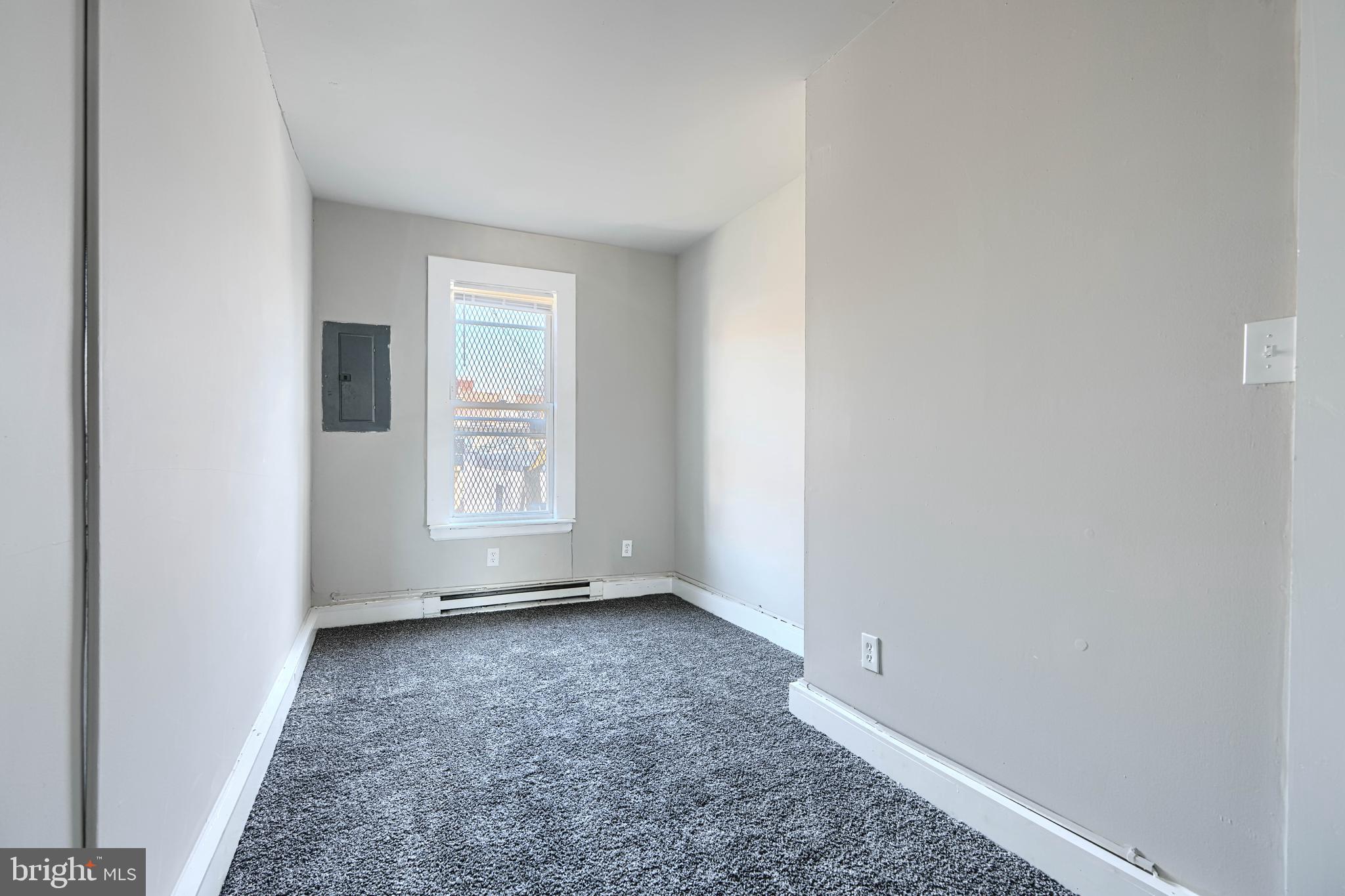 617 North Paca Street Baltimore, MD 21201 - Photo 19 of 20 an empty room with windows